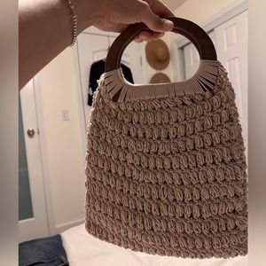 Super cute crochet bag with wood handles perfect for date night